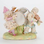 A porcelain group of two musical clowns, marked R.B. with crossed swords.The second half of the 20th