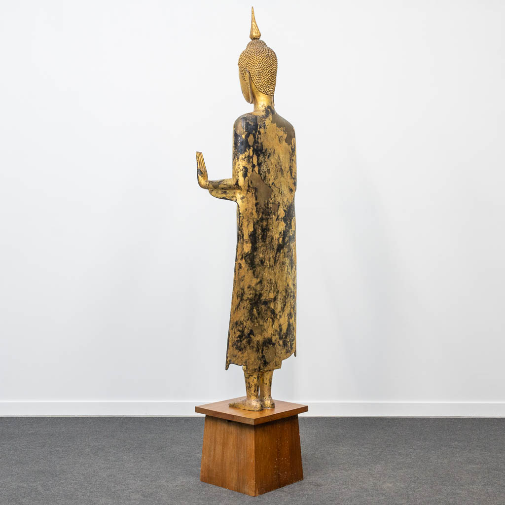 An antique buddha made of bronze and standing on a wood base. (28 x 48 x 180 cm) - Image 5 of 21