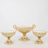 A collection of 3 bowls on a base Vieux Bruxelles, made of porcelain with ajoured edges and gilt acc