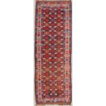 An Oriental hand-made runner carpet. Hamadan. (306 x 106 cm)