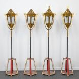 A set of 4 procession lamps in neogothic style standing in a frame. Made of wood and bronze. (42 x 3