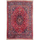 An Oriental hand-made carpet. Meshed. (297 x 203) (297 x 203 cm)