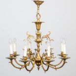 A chandelier made of bronze. Made around 1960-1970. (54 x 60 cm)