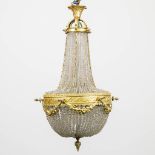 A Sac-a-Perles chandelier made of bronze and glass. The first half of the 20th century. (100 x 55 cm