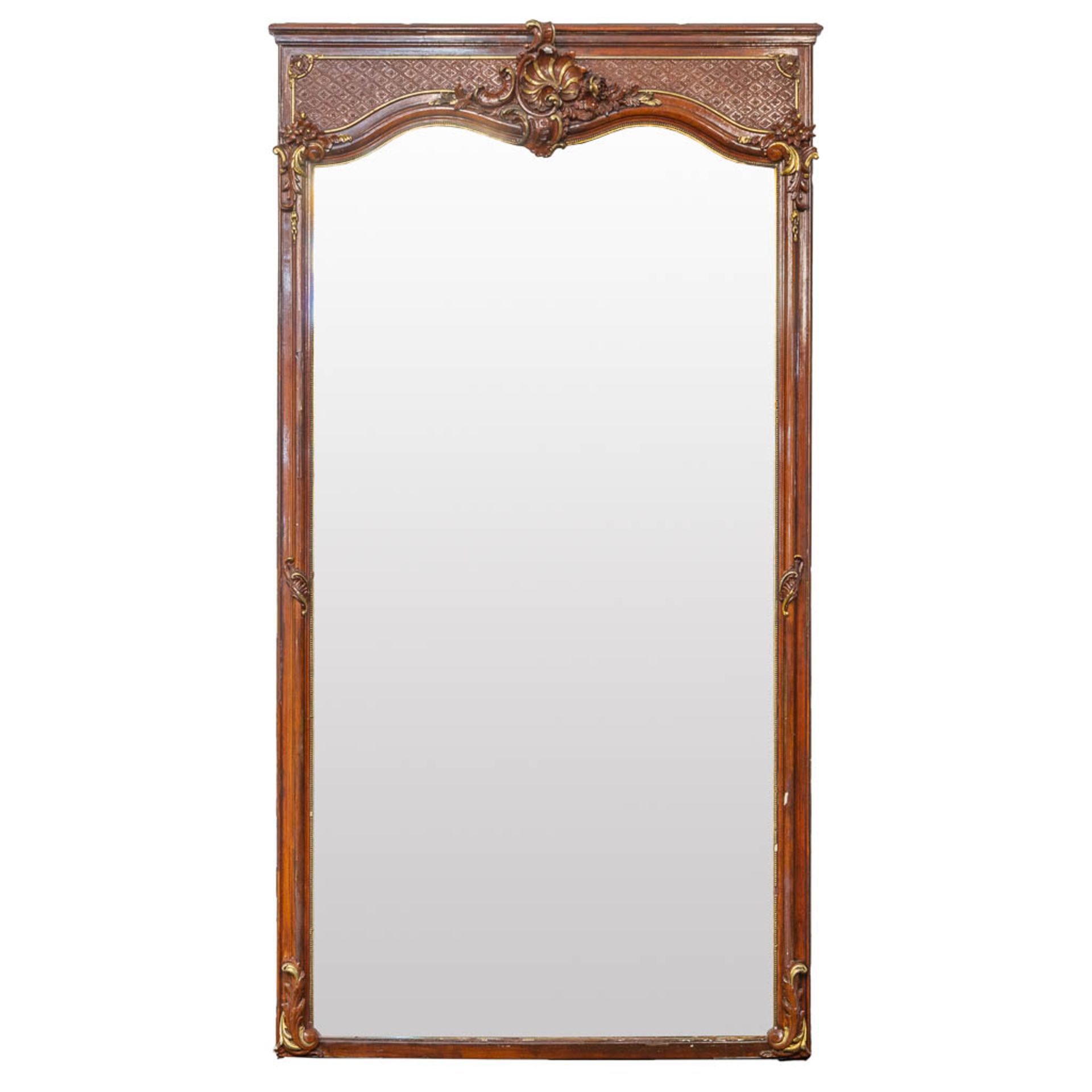 A large mirror made of sculptured wood and stucco in Louis XV style. (126 x 8 x 243 cm)