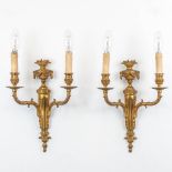 A pair of sconces made of gilt bronze in a Louis XVI style. The second half of the 20th century. (10