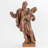 An antique wood sculptured statue of 'Joseph and Child.' 17th/18th century. (14 x 27 x 48 cm)