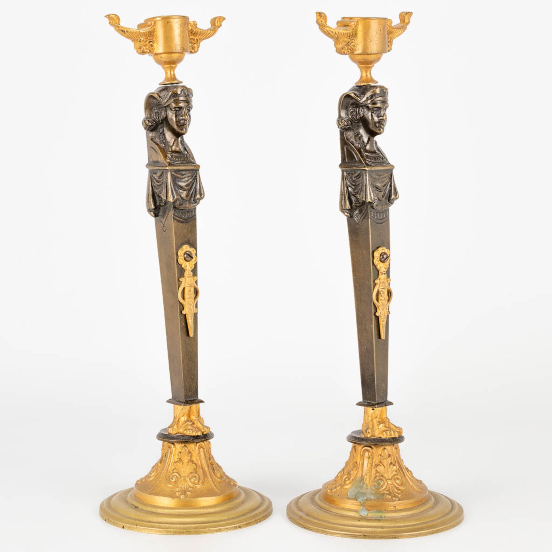 A pair of candlesticks made of gilt and patinated bronze in empire style. (27,5 x 9,5 cm) - Image 9 of 15