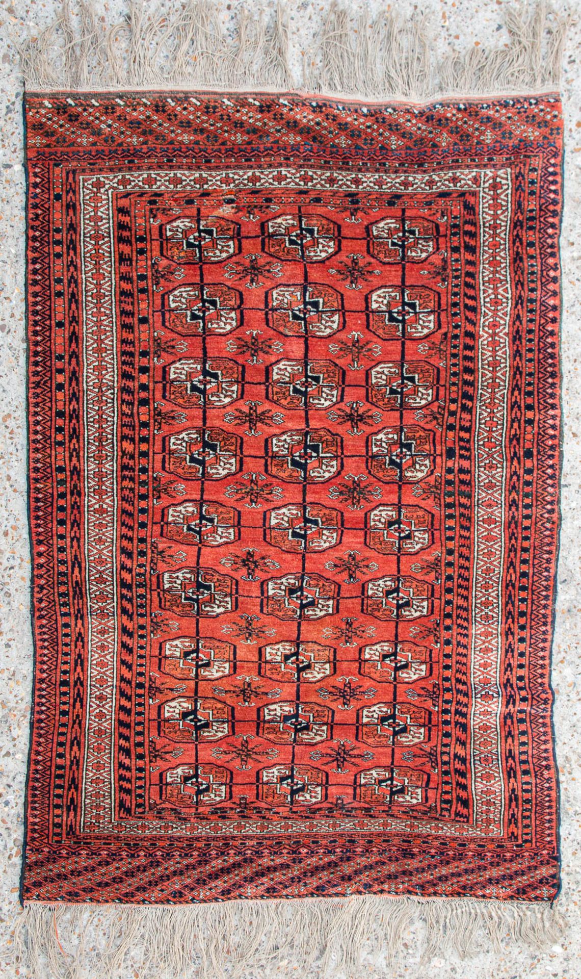 An Oriental hand-made carpet. Bokhara / Turkaman. (100 x 150 cm)