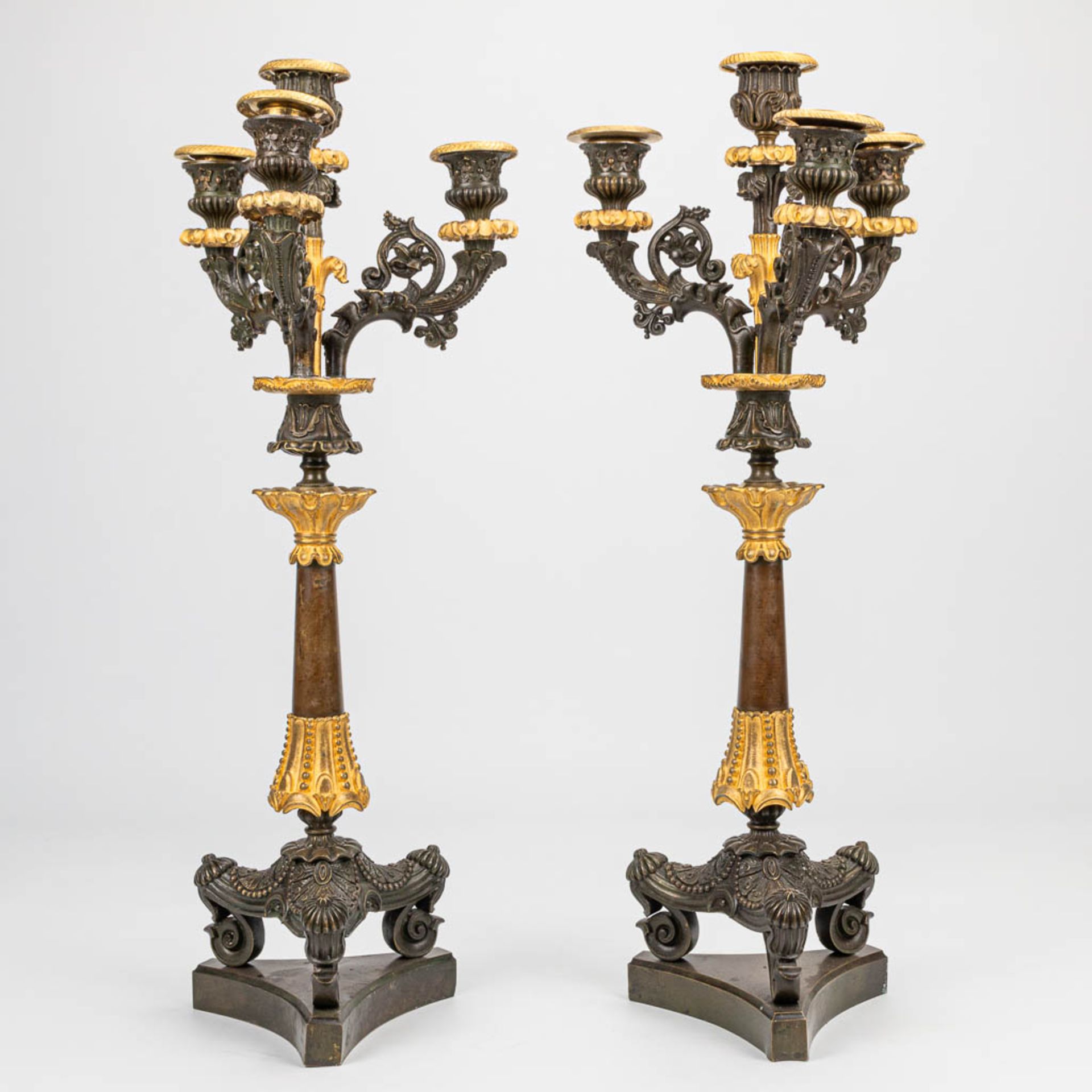 A pair of candelabra with gilt and patinated bronze in empire style, of the period. (16 x 20 x 51 cm - Image 3 of 6