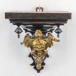 A wall console made of ebonised wood and mounted with bronze .19th century. (13 x 18,5 x 20 cm)
