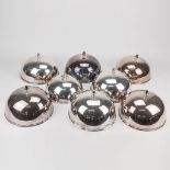 A collection of 8 silver-plated plate serving cloches of which 7 are marked L'ecuyer, France and 1 m