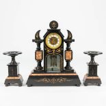 A 3 piece garniture clock made of black marble with engravings. 19th century. (13 x 42 x 51 cm)