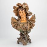 A terracotta bust of a lady, probably made by Amphora Teplitz. (21 x 30 x 51 cm)