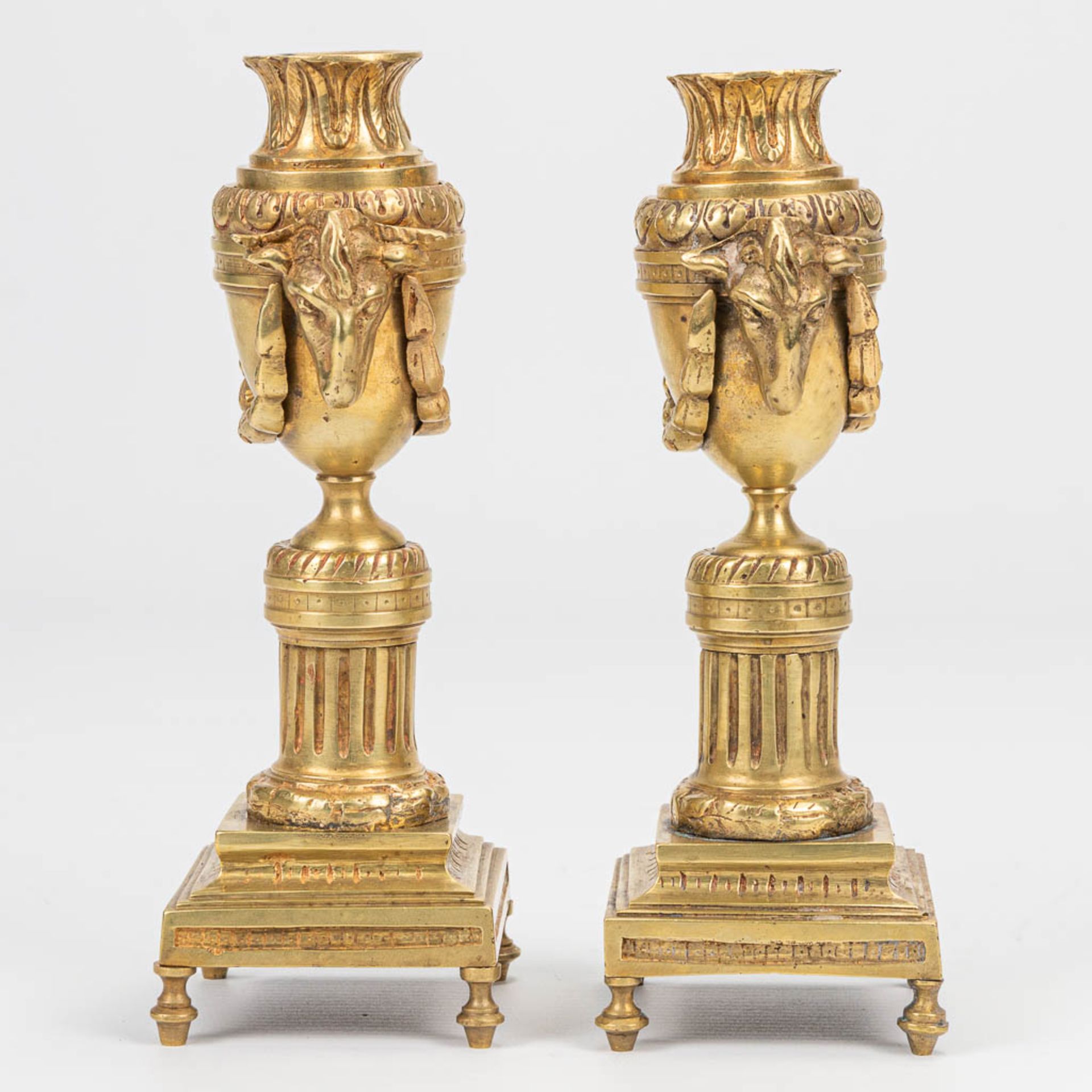 A pair of candlesticks with reversible candle holders and ram's heads in Louis XVI style. (7 x 8 x 1 - Image 4 of 8