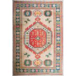 An Oriental hand-made carpet. (242 x 364 cm)