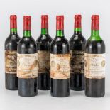 A collection of 6 bottles of Chateau Cheval Blanc Saint Emilion 1975. (30 x 7 cm)