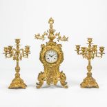 A 3 piece garniture clock made of bronze. 20th century. (10 x 30 x 62 cm)