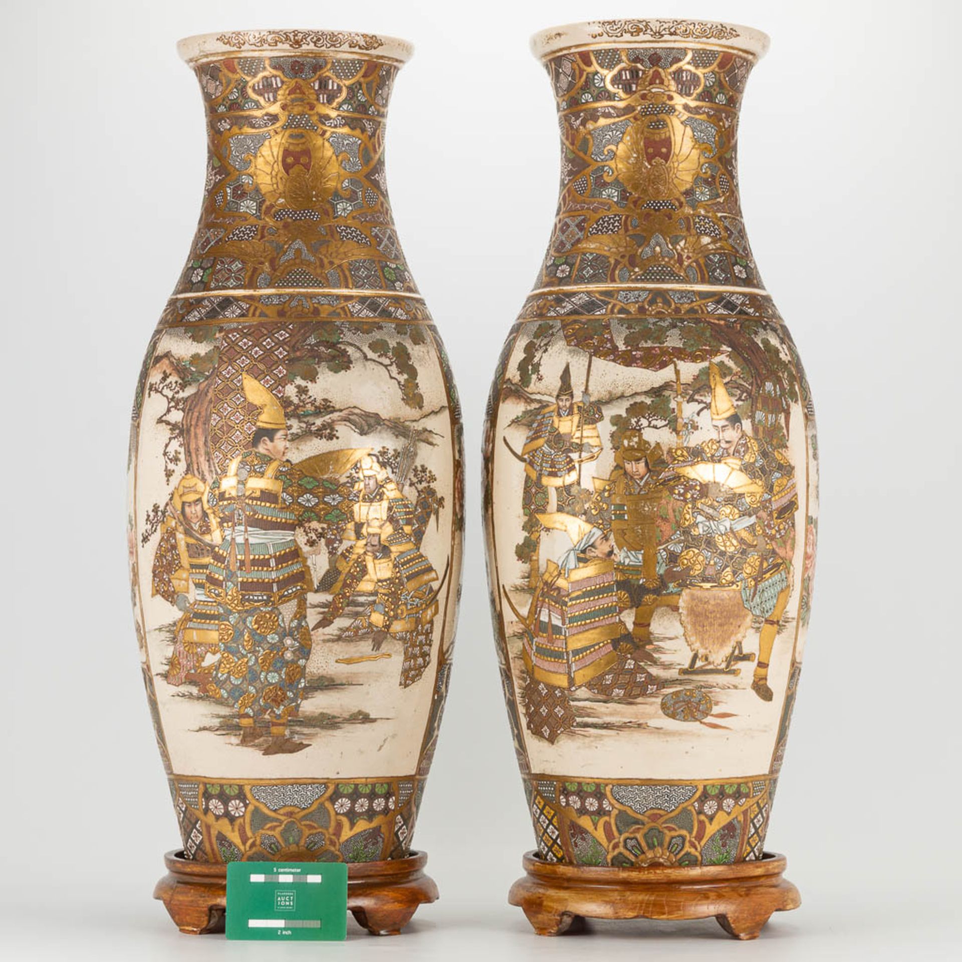 A pair of Japanese Satsuma vases with decor of warriors standing on a wood base. 19th/20th century. - Image 2 of 22