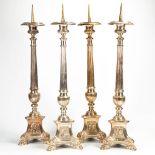 A set of 4 church candlesticks made of silver-plated bronze. Around 1900. (28 x 28 x 112 cm)