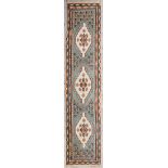 An Oriental hand-made carpet runner. Hamadan. (81 x 387 cm)