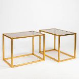 A pair of mid-century side tables made of brass and fume glass. (36 x 56 x 42 cm)