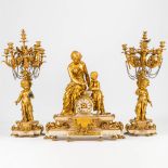 A 3 piece gilt garniture clock, decorated with putti a female figurine and made of alabaster and spe