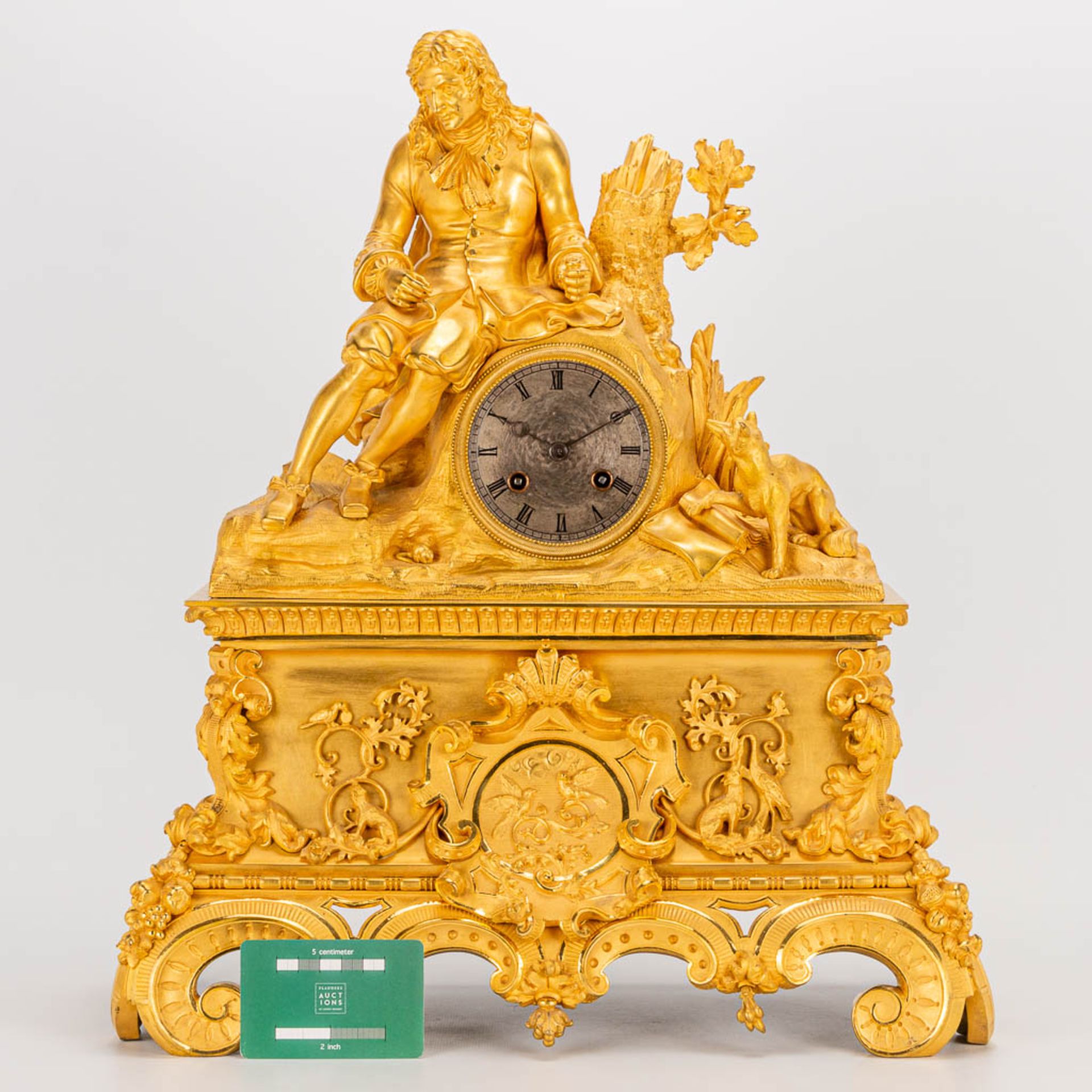 A table clock made of ormolu bronze with a sitting figurine. The second half of the 19th century. (1 - Image 8 of 24