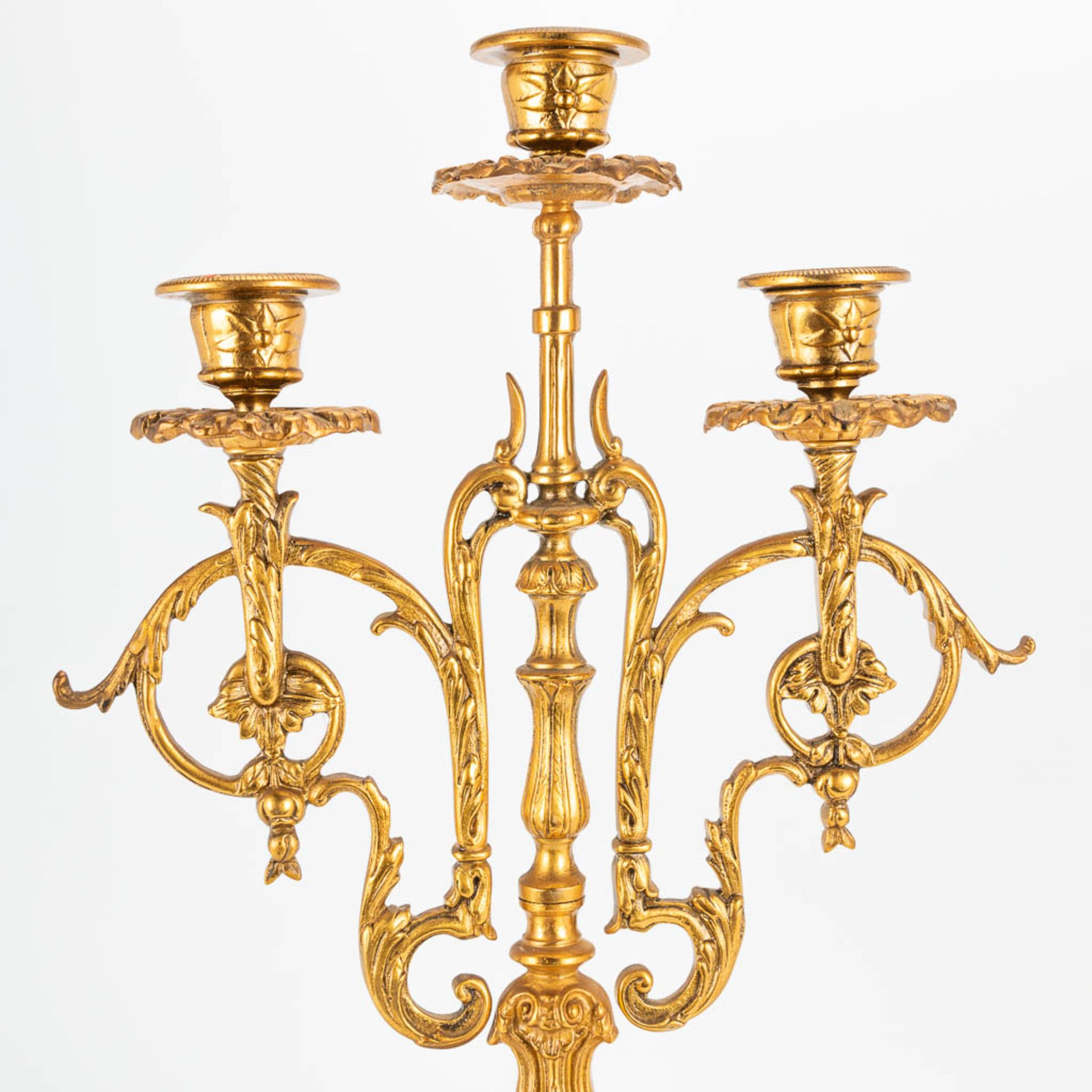 A 3 piece garniture clockset made of bronze, consisting of a clock and 2 candelabra. (9 x 22 x 41 cm - Image 6 of 17