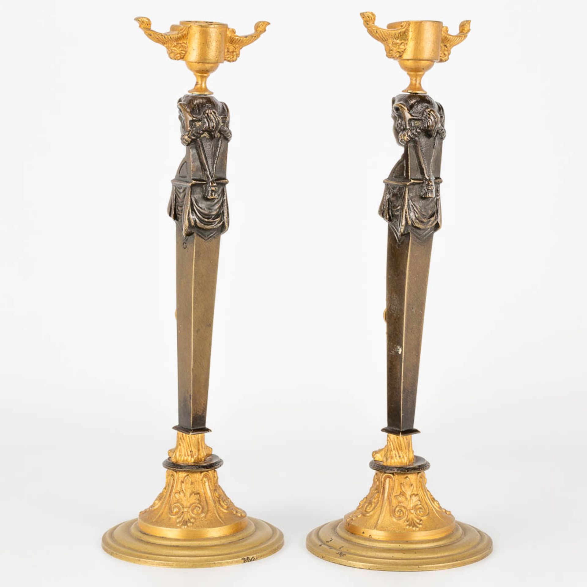 A pair of candlesticks made of gilt and patinated bronze in empire style. (27,5 x 9,5 cm) - Image 4 of 15