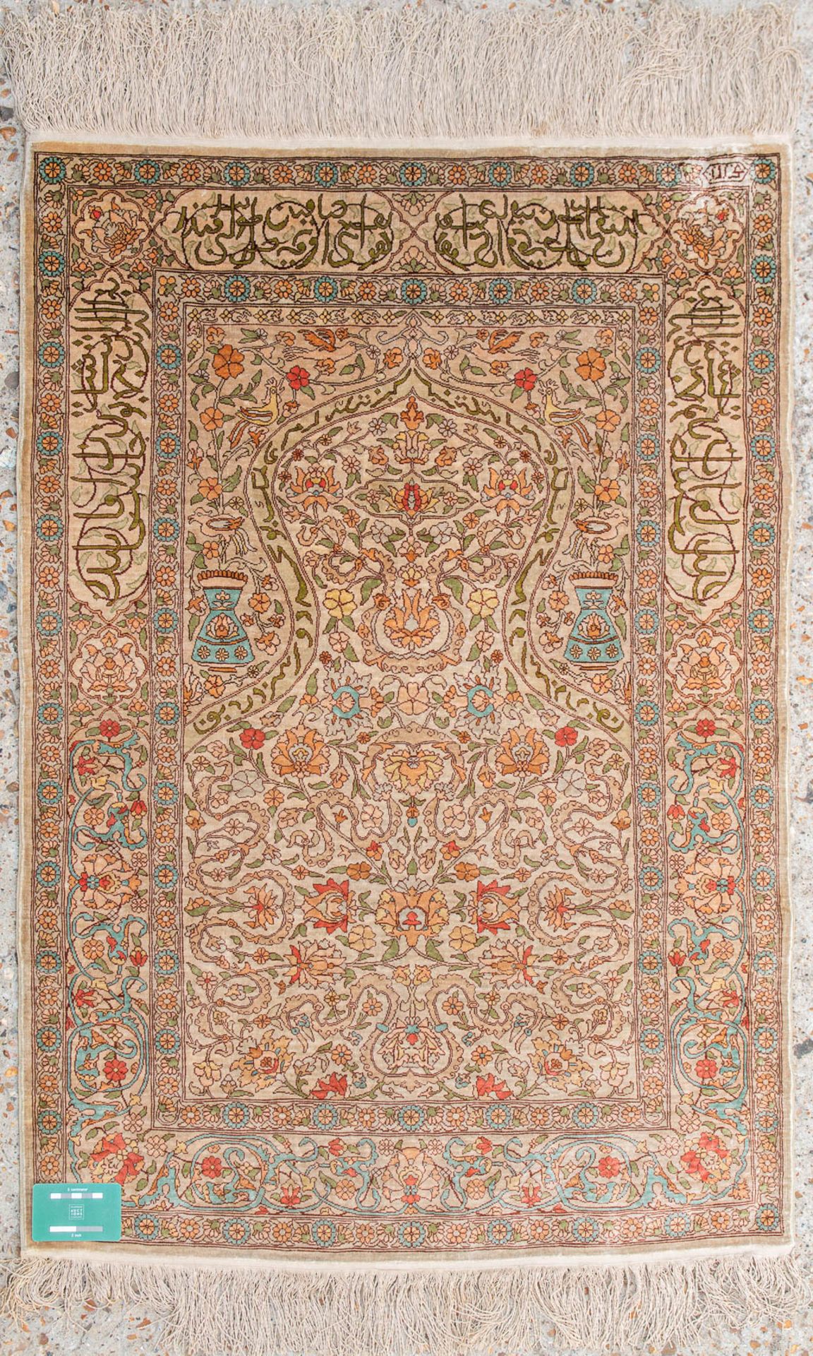 An Oriental hand-made carpet made of silk and signed. (73,5 x 107 cm) - Image 6 of 6