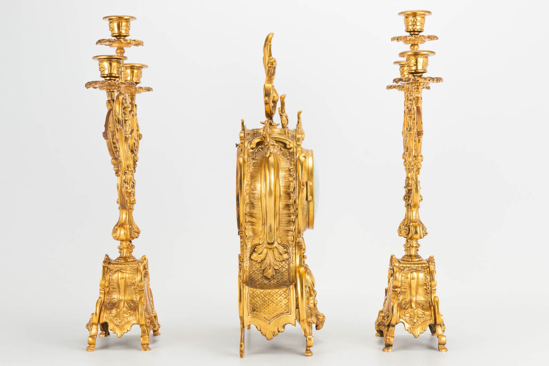 A 3 piece garniture clockset made of bronze, consisting of a clock and 2 candelabra. (9 x 22 x 41 cm - Image 4 of 17