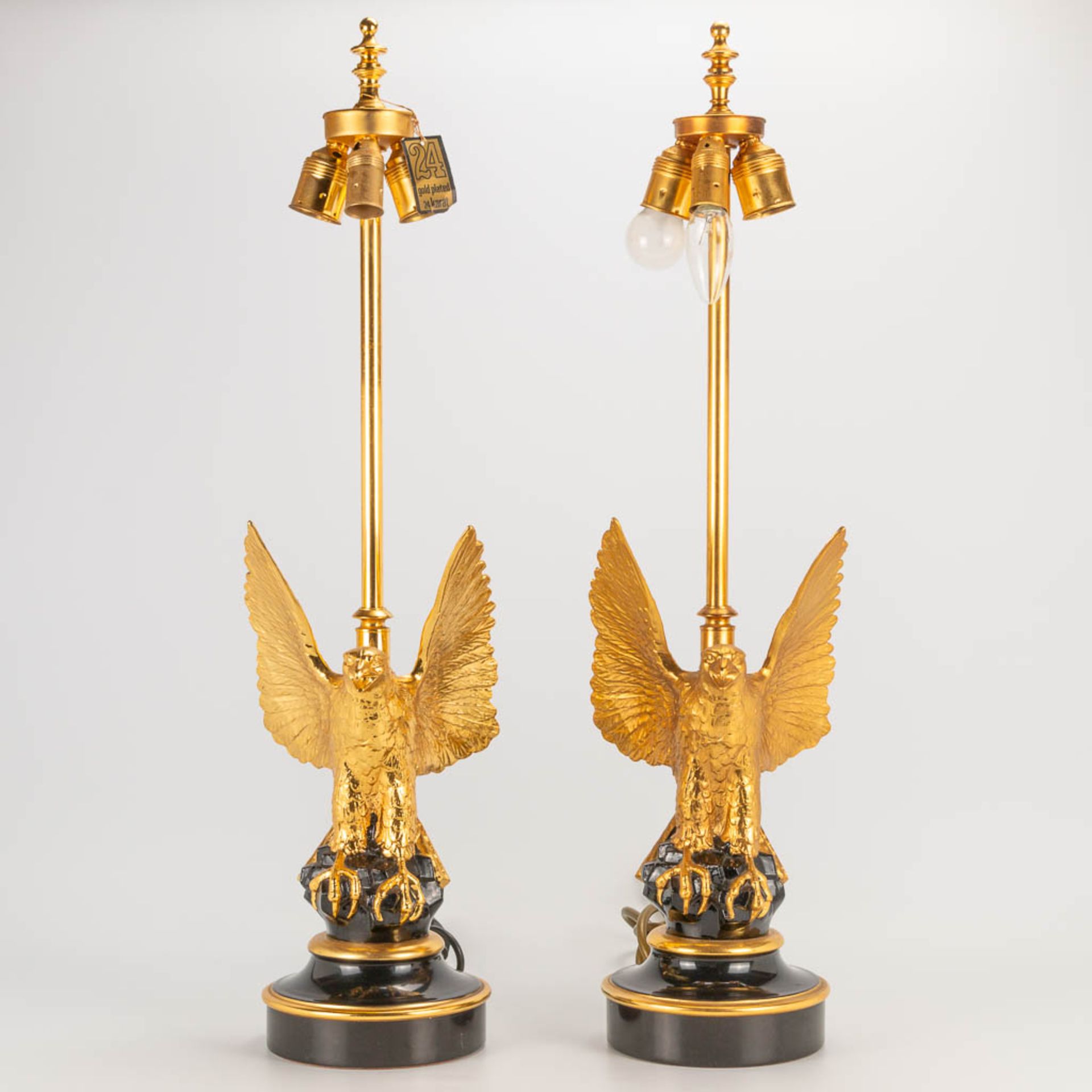 A pair of Deknudt table lamps of an eagle, metal on a porcelain base, 1970-1980. Hollywood Regency s