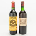 A bottle of Chateau Angelus, 1998, and a bottle of Chateau Lafite-Rothschild, 1973. (30,5 cm)