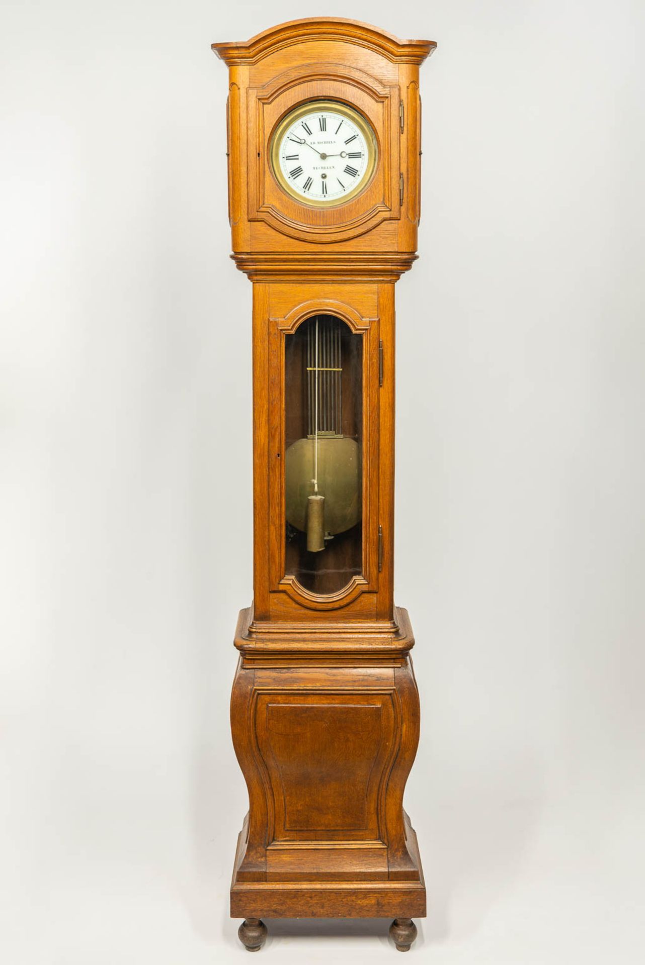 A large standing clock with compensation pendulum, 19th century. Marked Ed. Michiels Mechelen. (53 x
