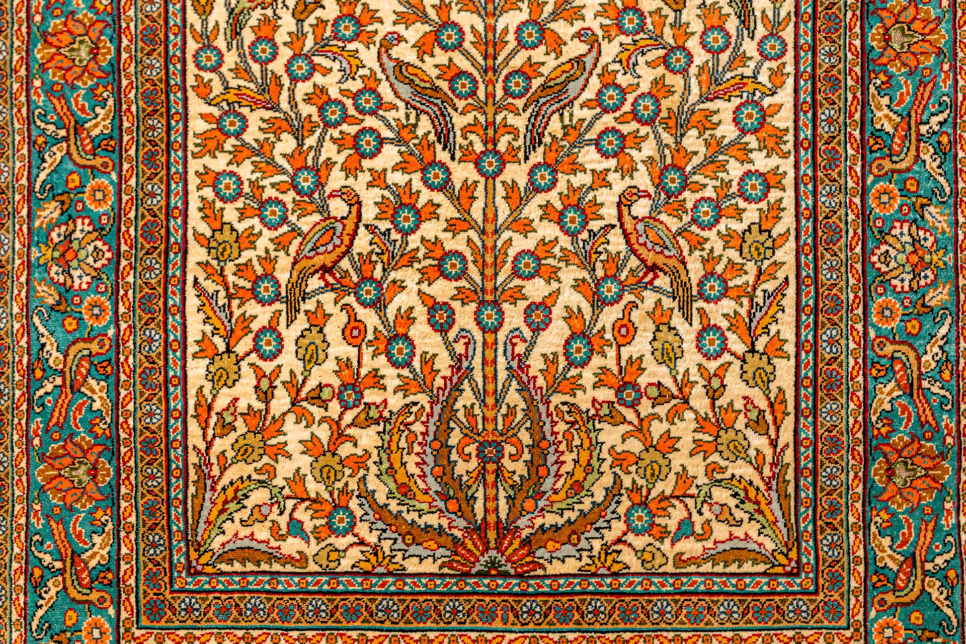 A hand-made silk carpet with 'Tree of life' decor and marked Kayseri. Signed. (112 x 75 cm) (75 x 11 - Image 7 of 8