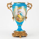 A spelter-mounted Bleu de Celeste vase, Sevres, with hand-painted decor, missing lid. 16 x 27 x 34,5