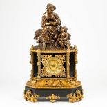 A clock made of black marble mounted with gilt bronze and a bronze statue 'The harvest'. 19th centur
