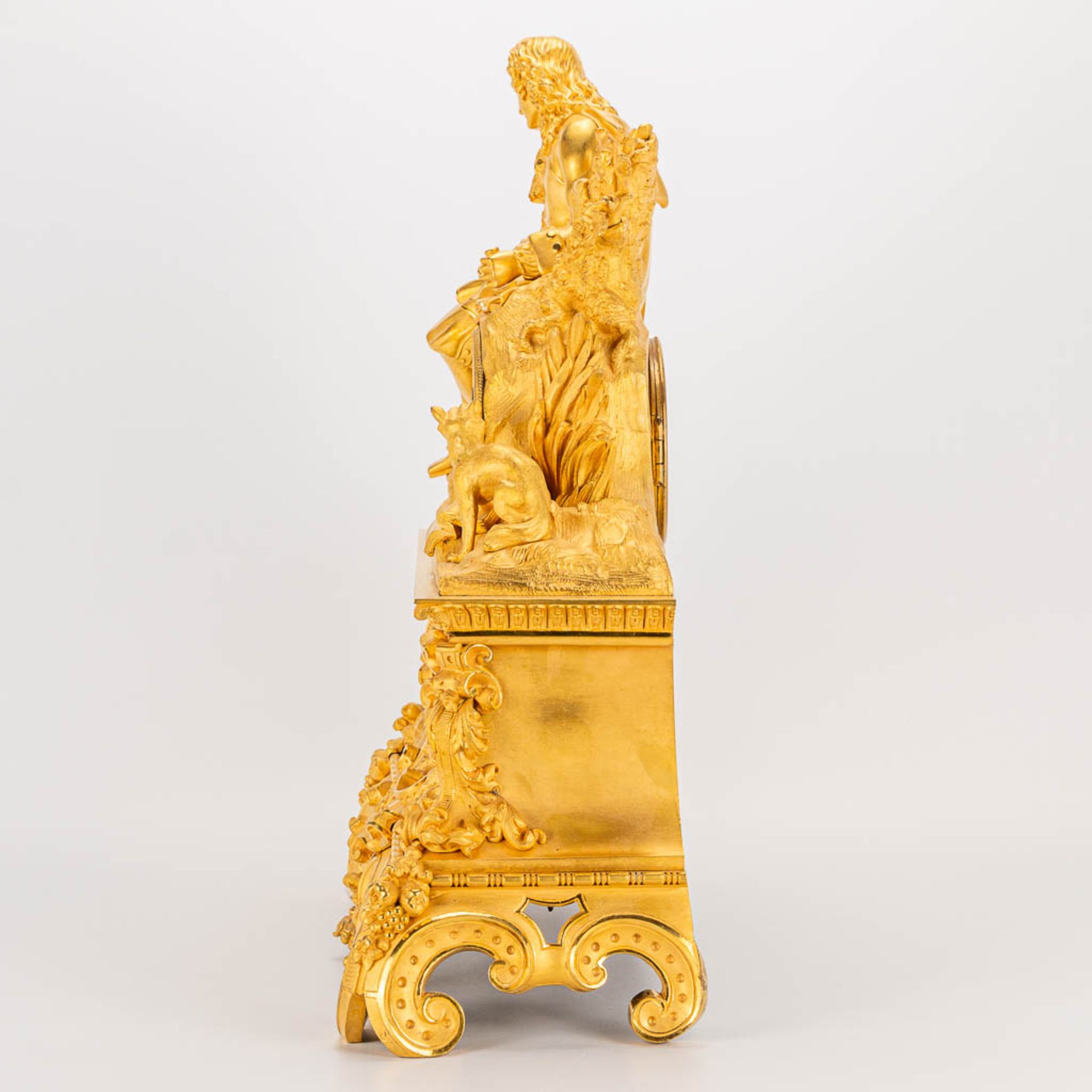 A table clock made of ormolu bronze with a sitting figurine. The second half of the 19th century. (1 - Image 3 of 24