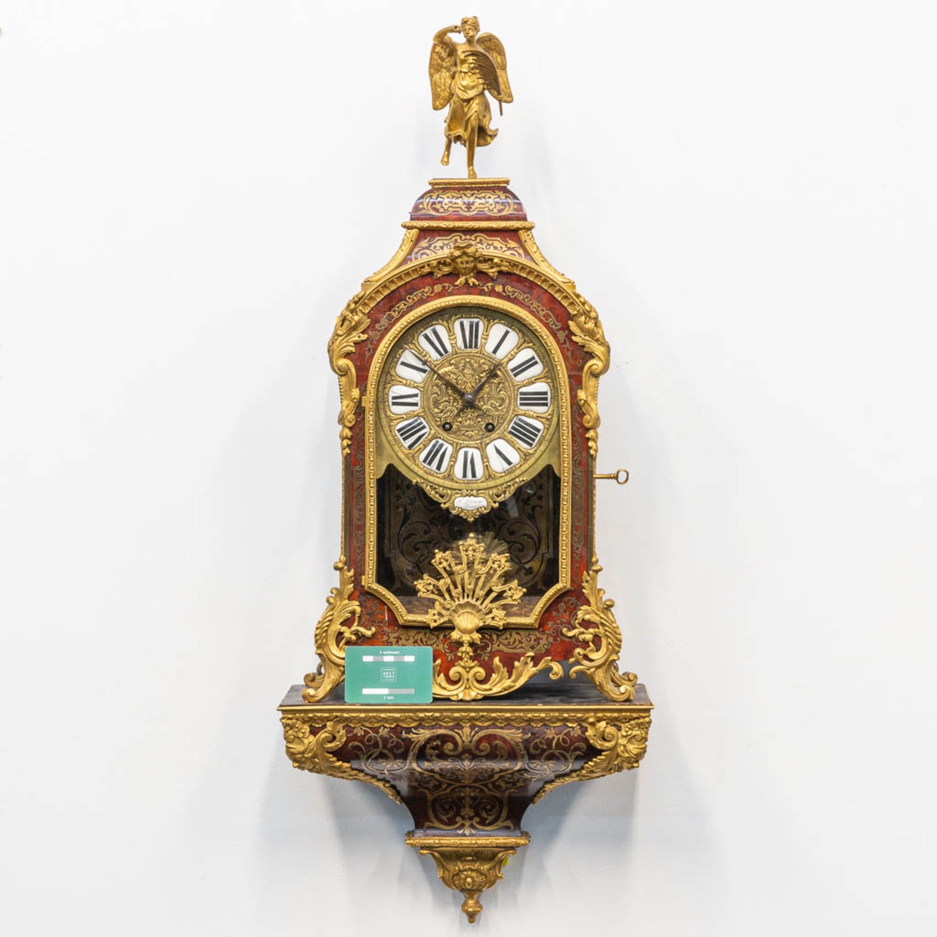 A cartel clock, finished with tortoise shell in a boulle technique, and mounted with gilt bronze. 19 - Image 2 of 10