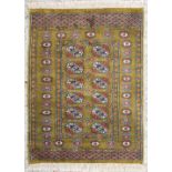 An Oriental hand-made carpet. Bokhara / Turkaman. (77 x 105,5 cm)