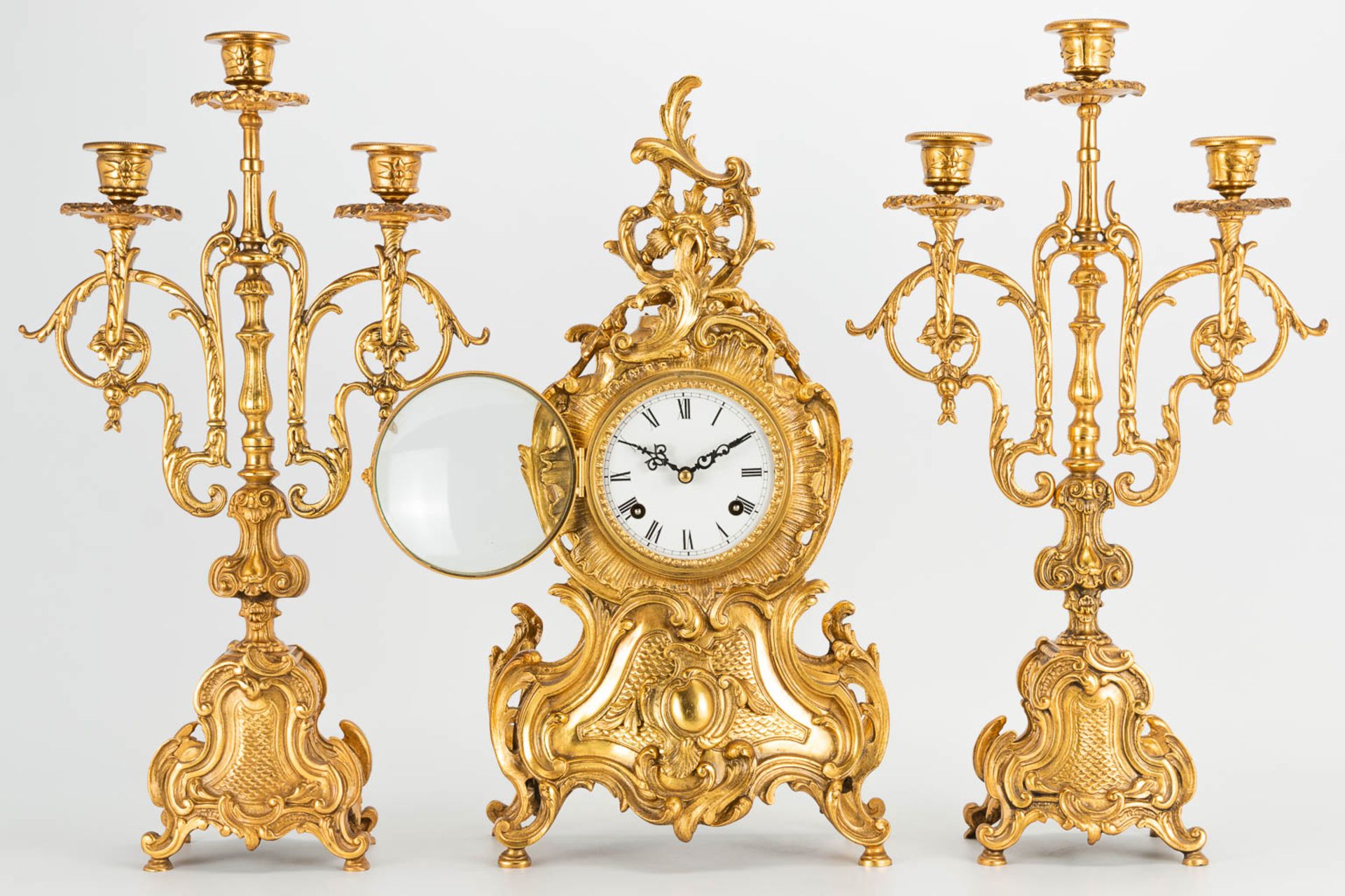 A 3 piece garniture clockset made of bronze, consisting of a clock and 2 candelabra. (9 x 22 x 41 cm - Image 13 of 17