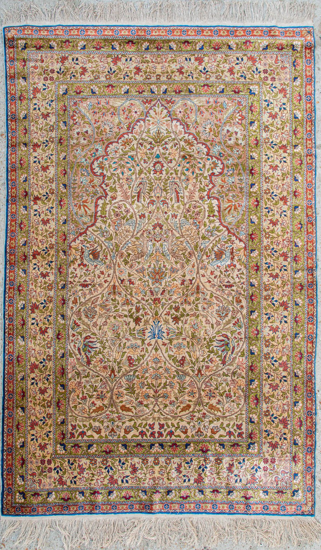 An Oriental hand-made carpet made of silk and marked Hereke (191 x 120) (120 x 190 cm)