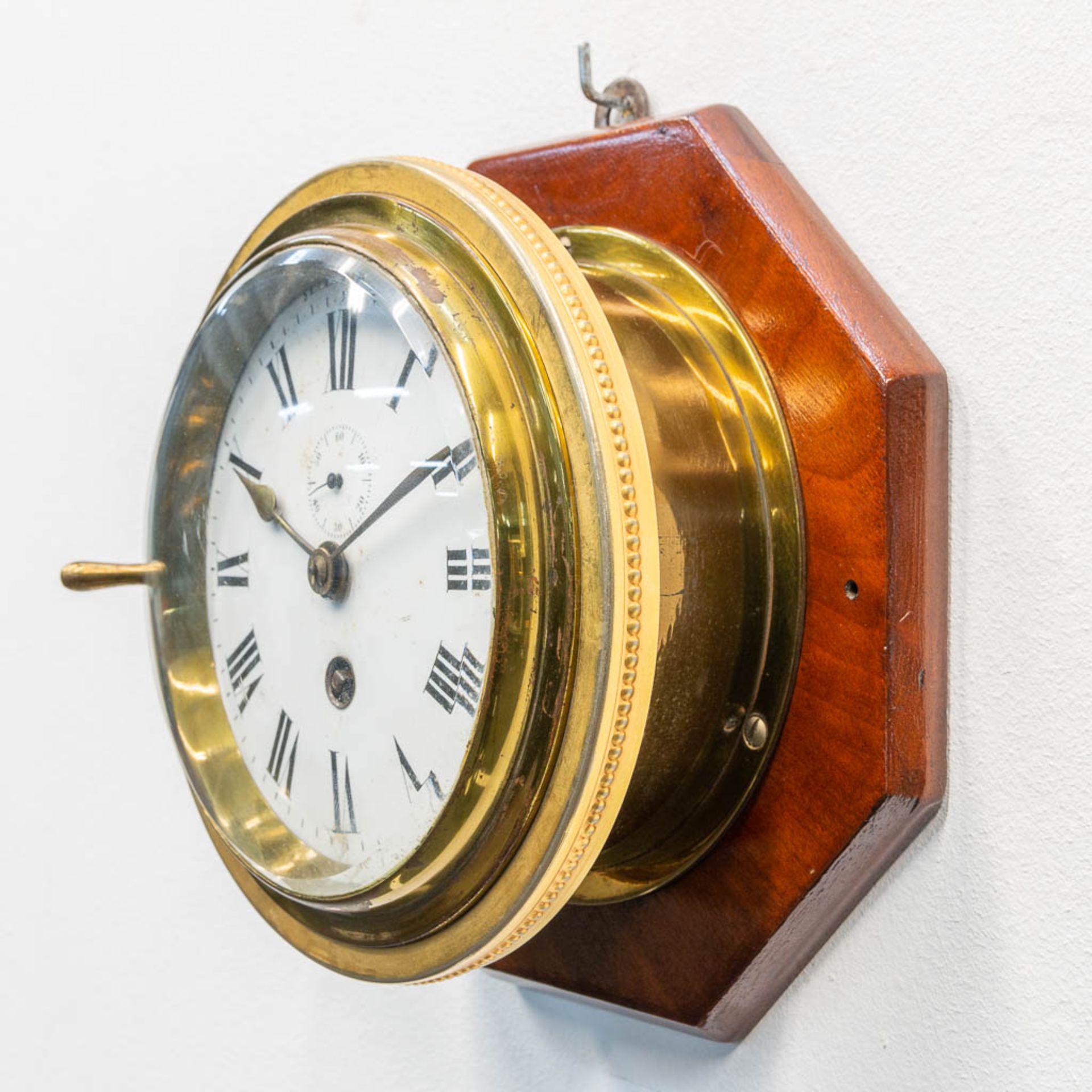 A ship clock mounted on wood, the first half of the 20th century. (9 x 20 cm) - Image 3 of 7