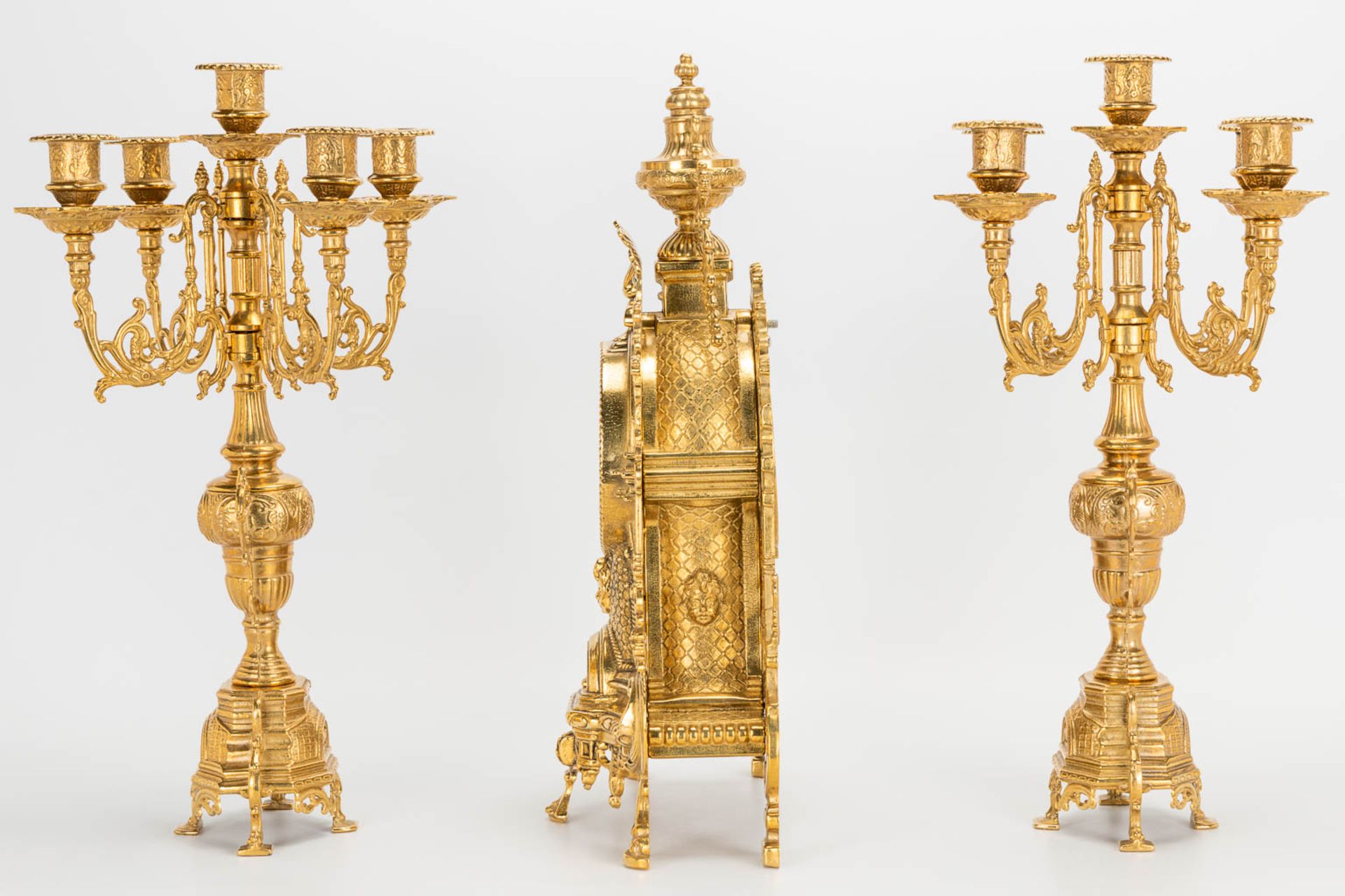 A 3 piece garniture clockset made of bronze, consisting of a clock and 2 candelabra. Battery operate - Image 4 of 14