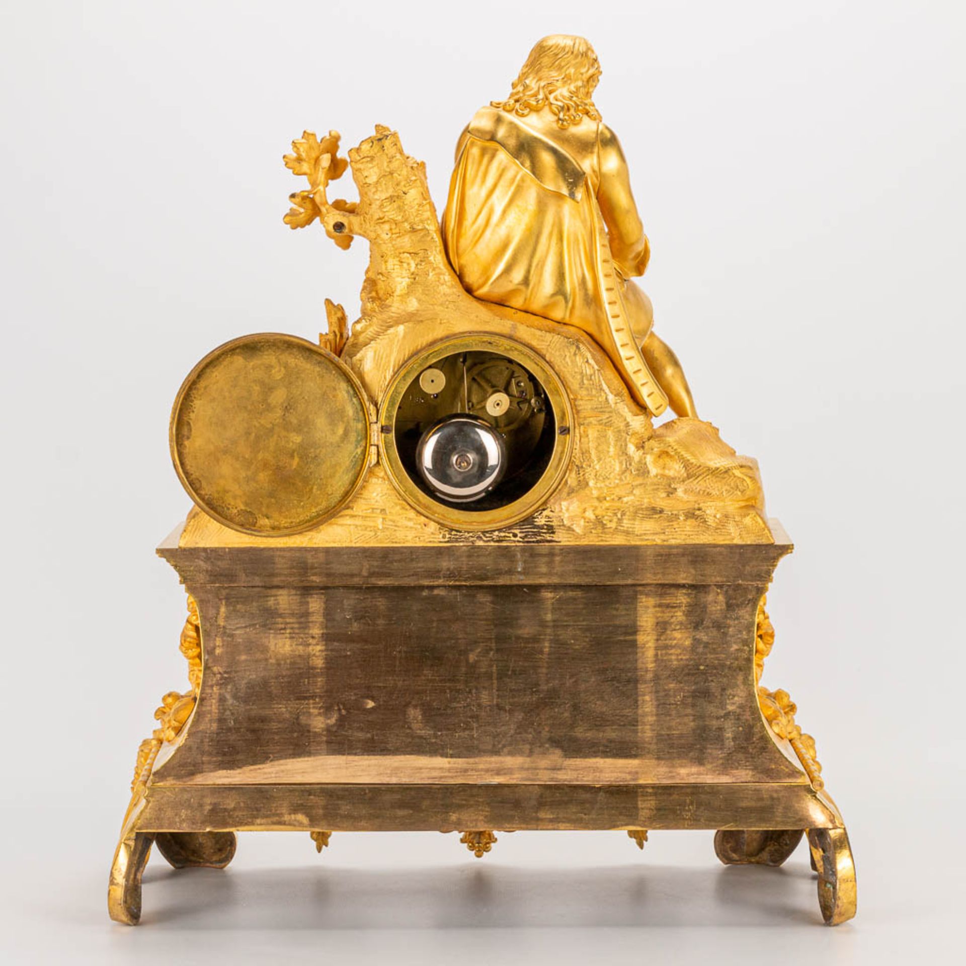 A table clock made of ormolu bronze with a sitting figurine. The second half of the 19th century. (1 - Image 6 of 24