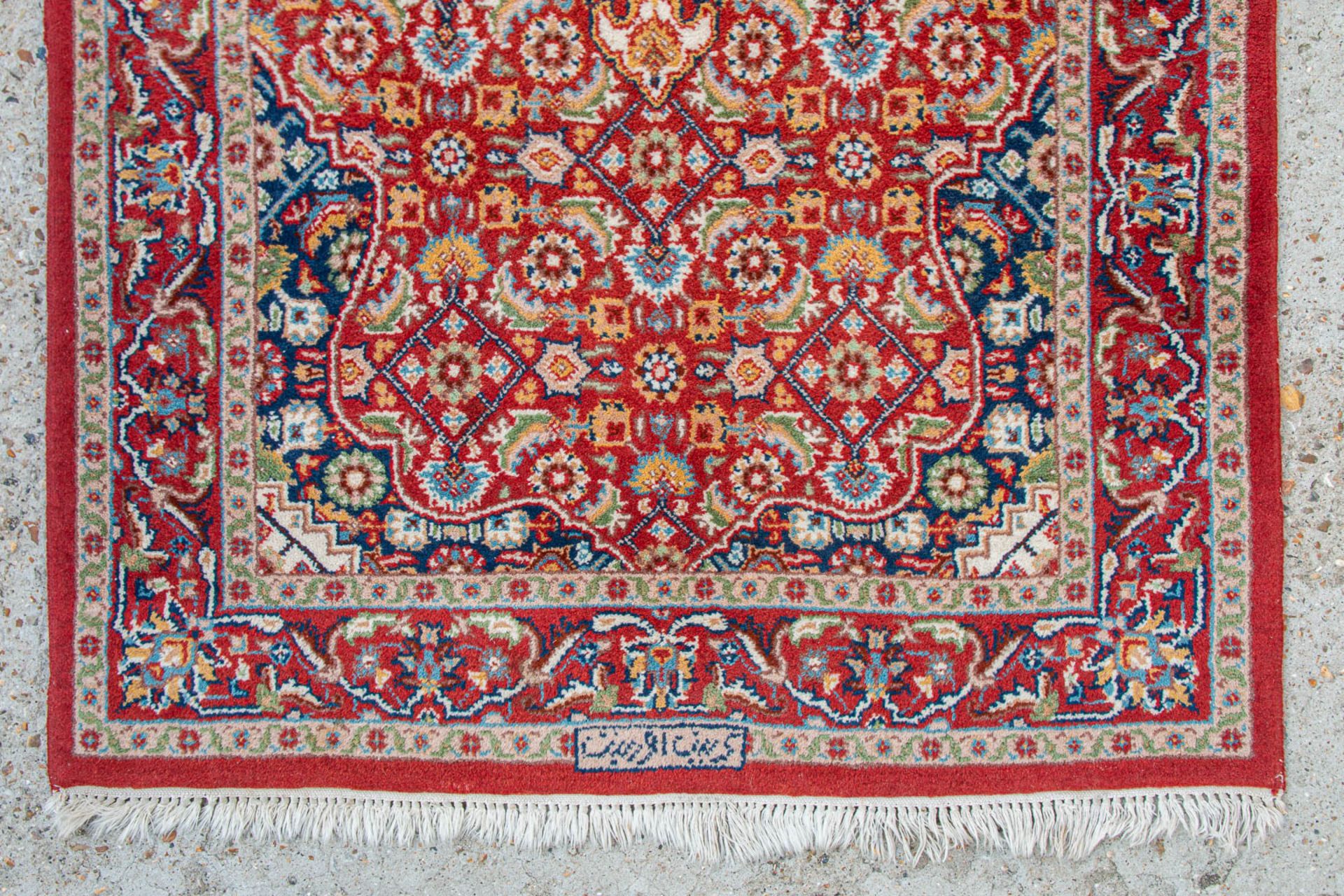 An Oriental hand-made carpet. Kerman with signature. (90 x 155 cm) - Image 4 of 6