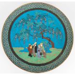 An antique cloisonne display plate with decor of figurines under a tree, 19th century. (49 cm)