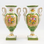 A pair of empire style display vases with hand-painted flower decor, relief swans and finished with