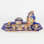 A hand-painted and transferprint miniature coffee service marked Royal Vienna, around 1900. (23 x 35